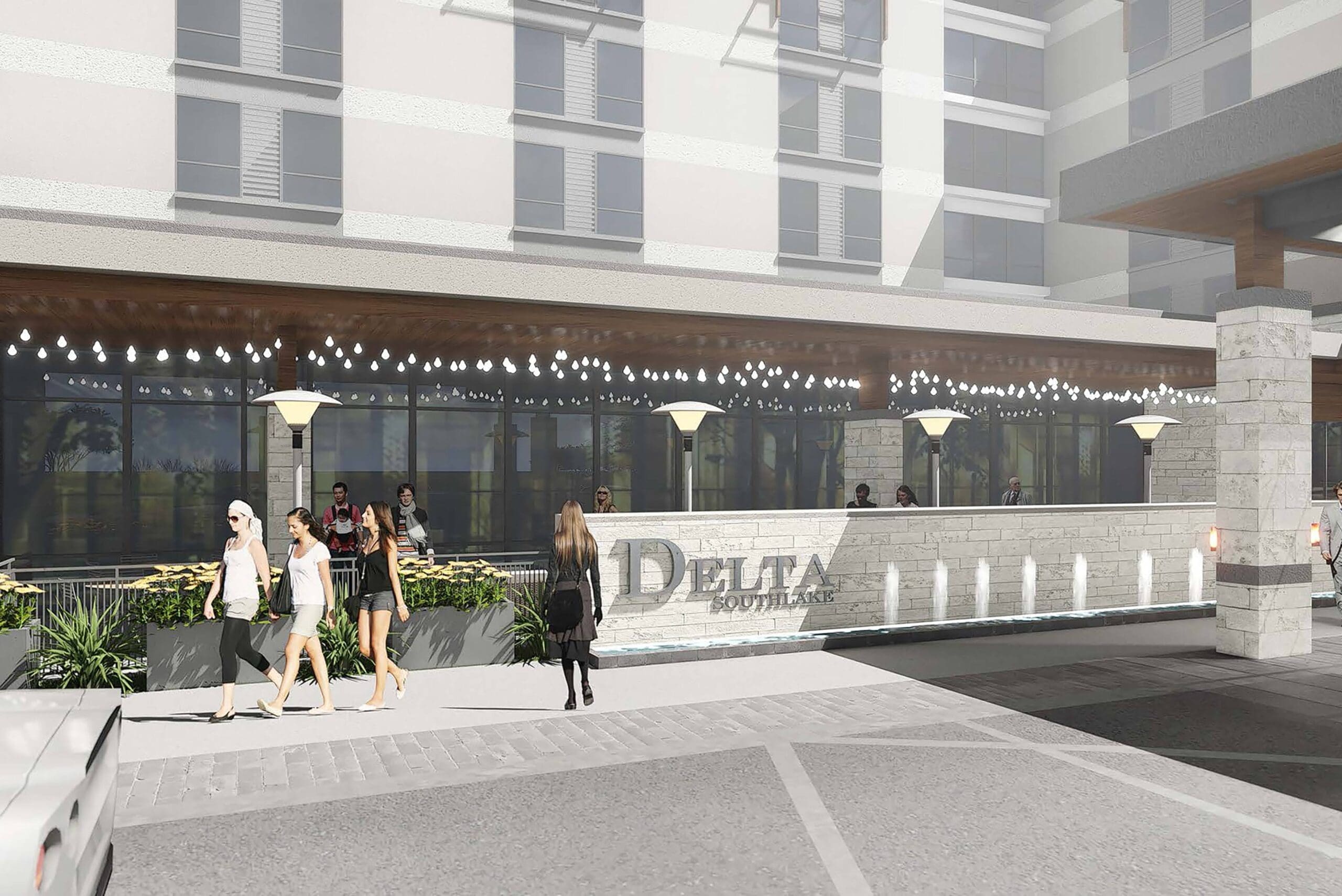 Street view of a hotel entrance with "Delta" signage. Several people walk along the sidewalk, and others are near the entrance. The building features a row of lights and modern architectural elements.