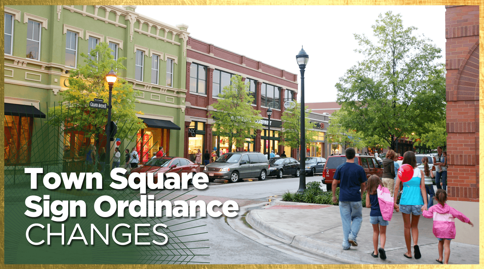 A family walks along a town square street lined with shops and trees. The buildings have colorful facades. A streetlamp is visible, and the foreground features text: "Town Square Sign Ordinance Changes.