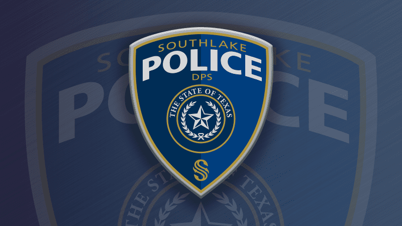 Blue and gold police badge with "Southlake Police DPS" and "The State of Texas" emblem featuring a star and laurel. The badge is set against a larger, blurred version of the badge in the background.