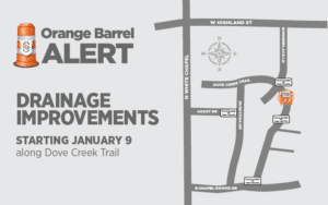 Map of drainage improvements starting January 9 along Dove Creek Trail. It highlights locations on Dove Creek Trail near Ascot Dr and E Chapel Downs Dr. Title reads "Orange Barrel Alert" with a barrel icon.