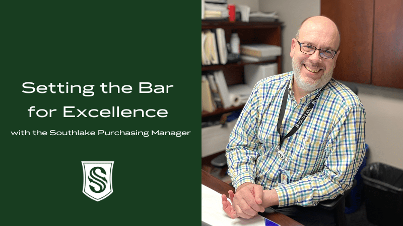 A man with glasses and a beard, wearing a plaid shirt, sits smiling at a desk in an office. Text reads, "Setting the Bar for Excellence with the Southlake Purchasing Manager." A logo with the letter "S" is in the bottom left corner.