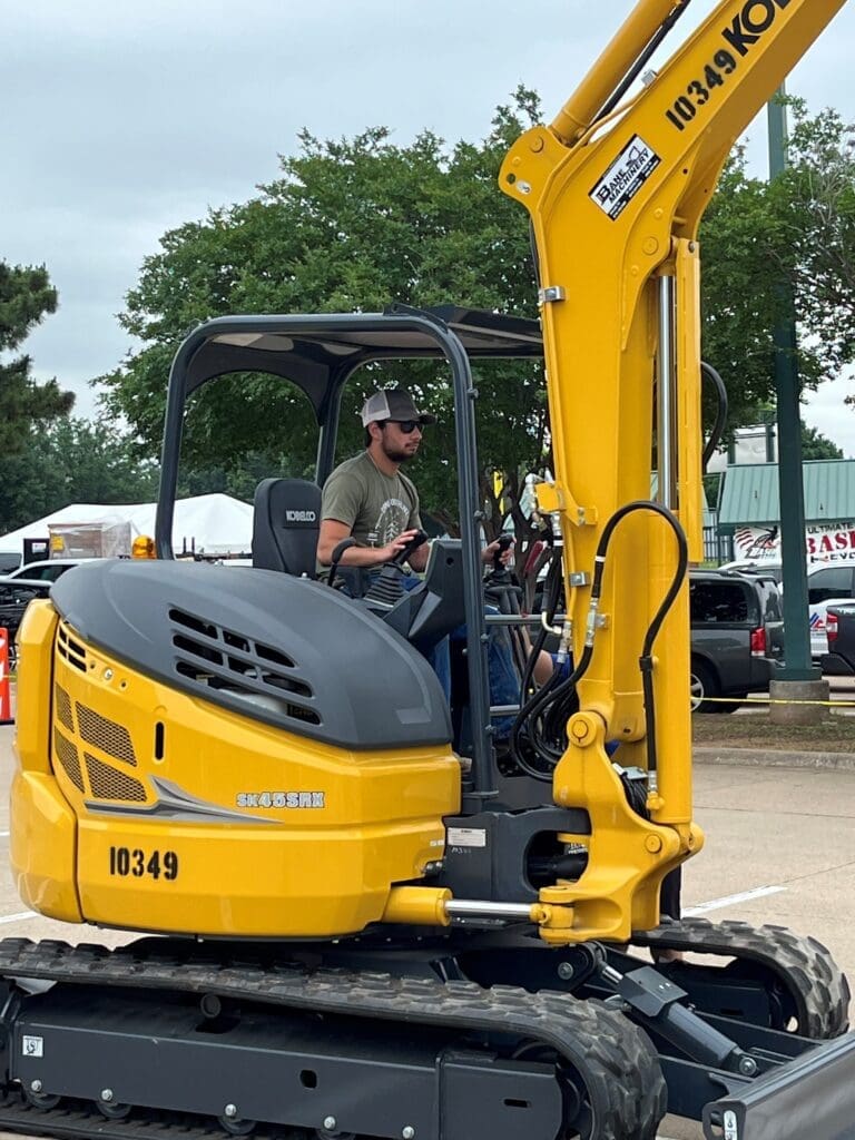 Photo of a man in a trackhoe