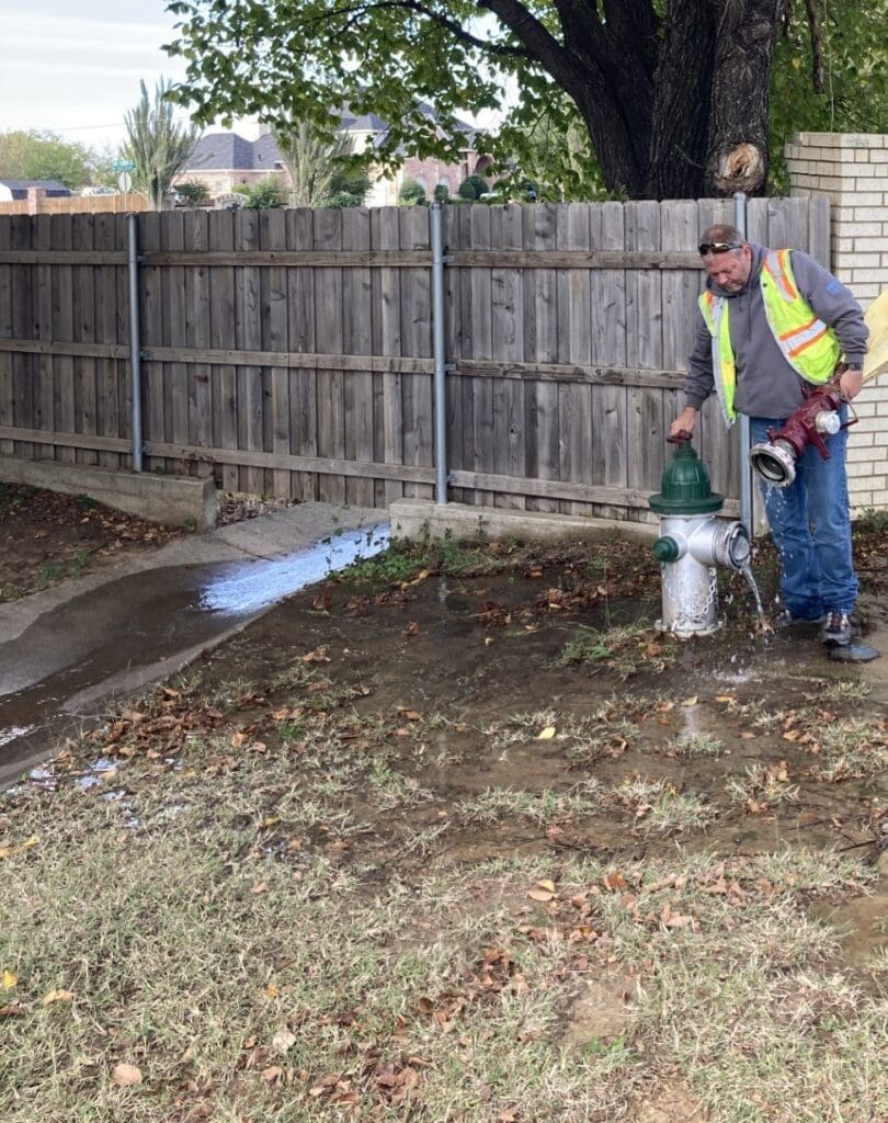Photo of a man fixing a leak