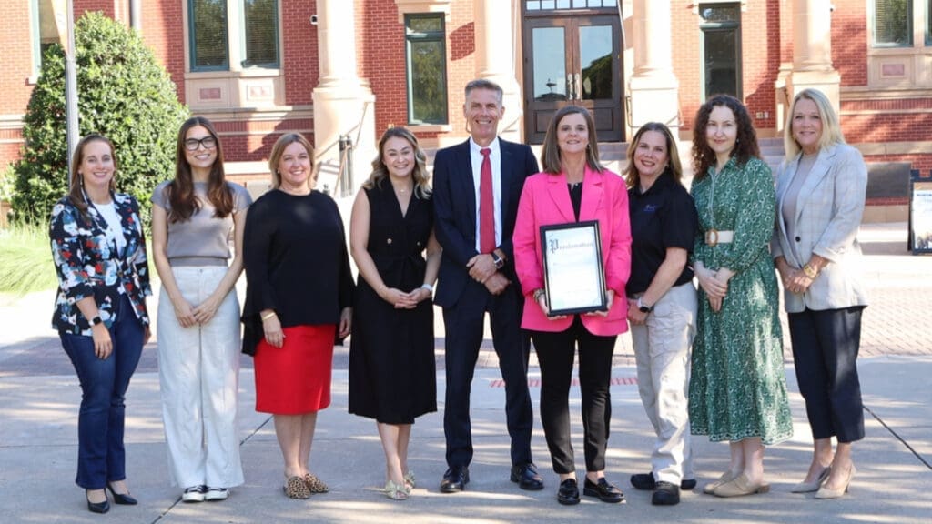 Photo of a group of people smiling