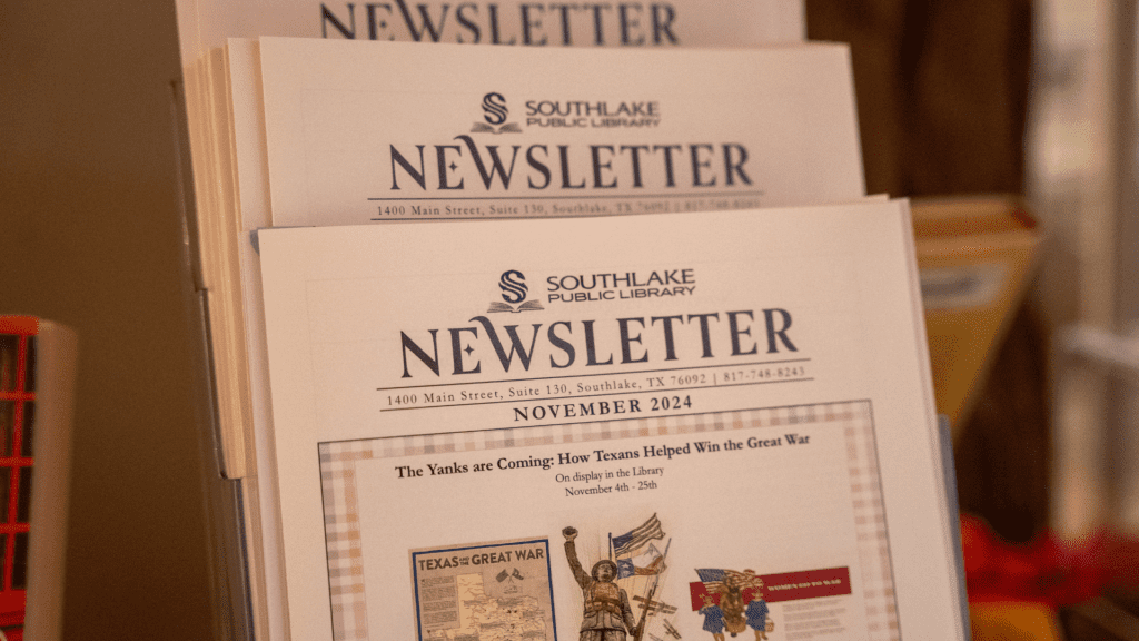 Image of the Southlake Library newsletter stacked waiting for patrons to grab.