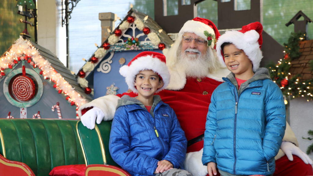 Photo of a family smiling with Santa