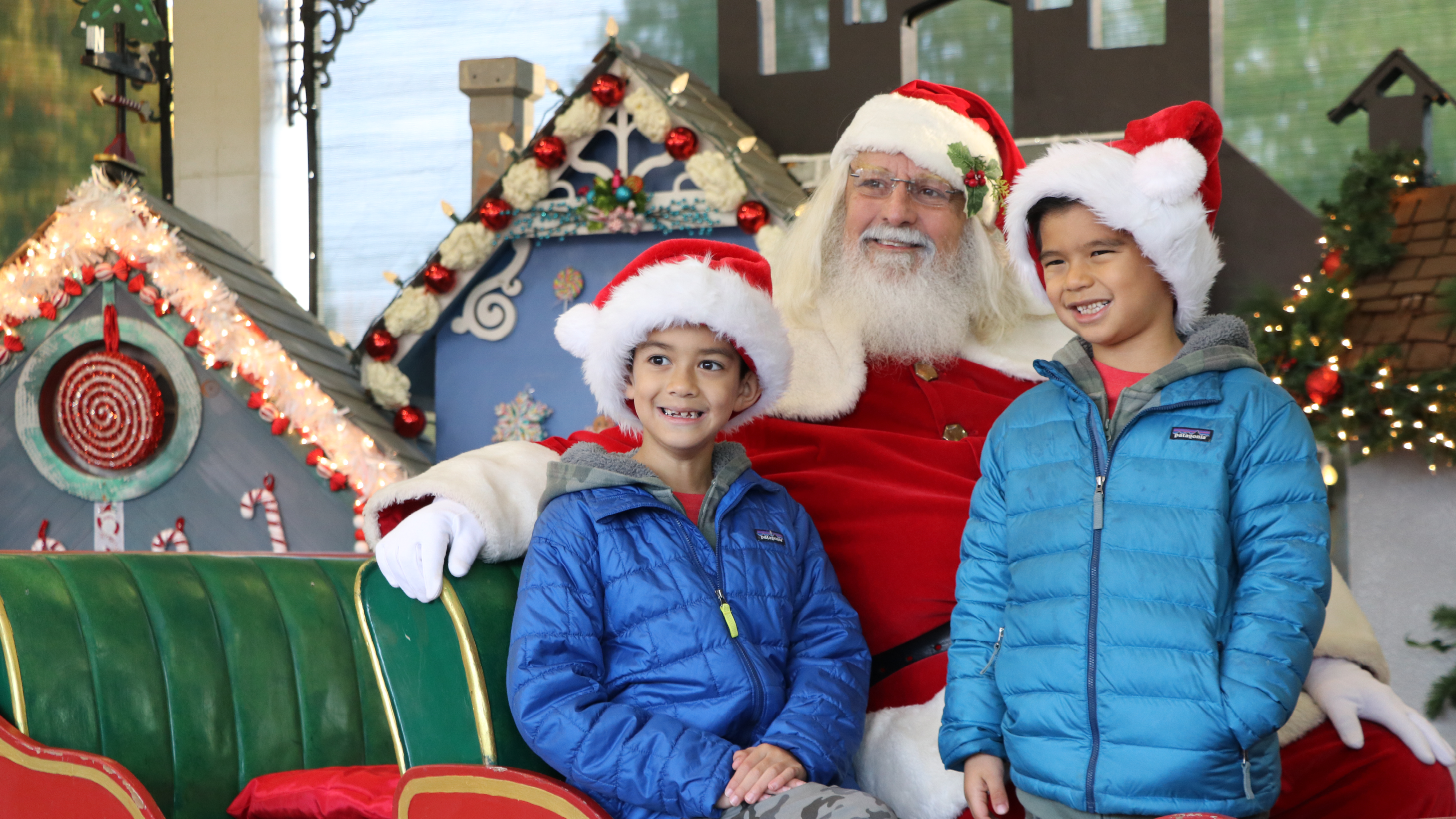 Photo of a family smiling with Santa