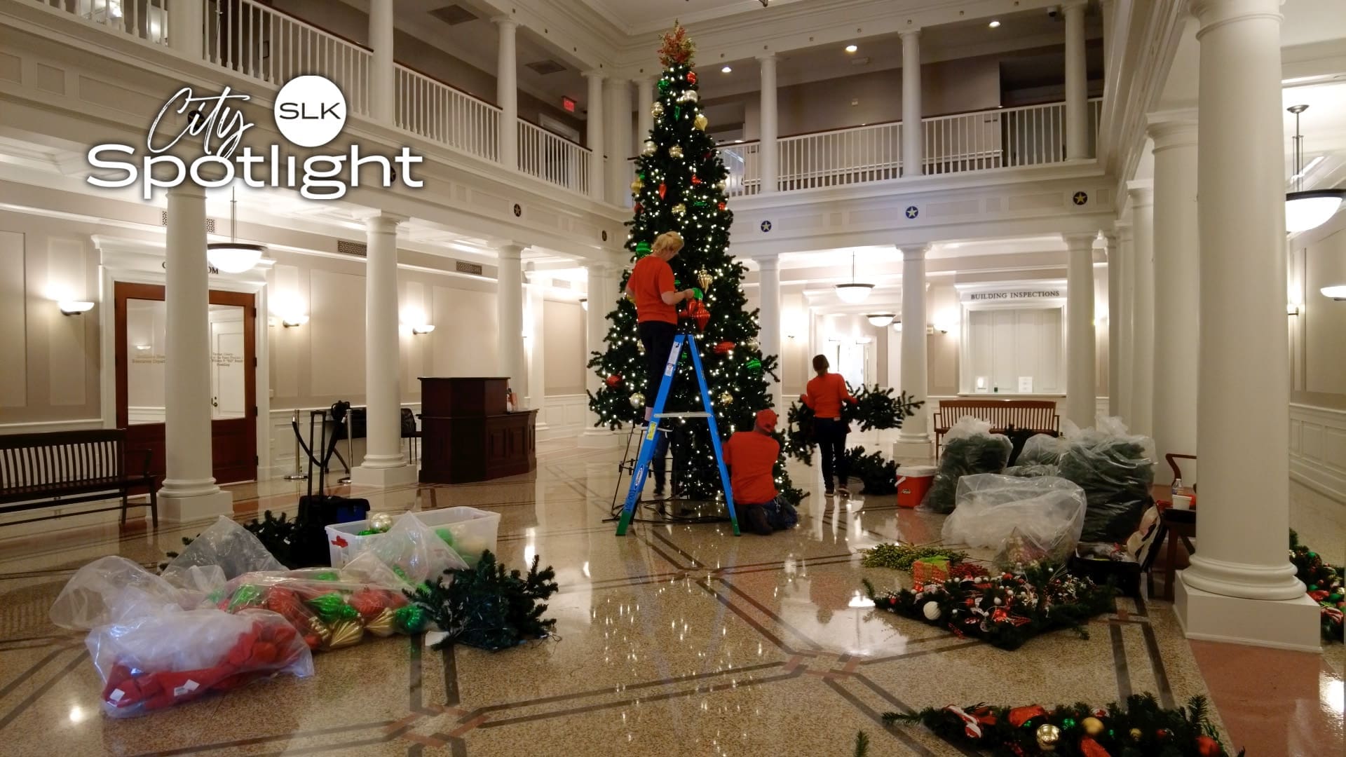 Image of the Town Hall Christmas tree being decorated.