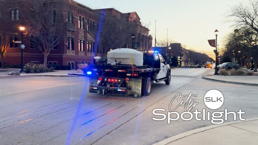 Image of Southlake Public Works Truck laying brine on the road in front of Town Hall.