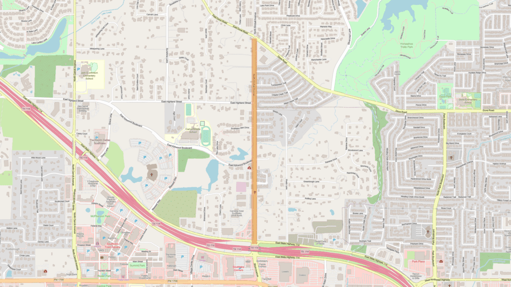 A detailed map showing streets, parks, lakes, neighborhoods, and commercial areas, with major roads highlighted in yellow and pink, and green spaces in the upper and central parts of the image.