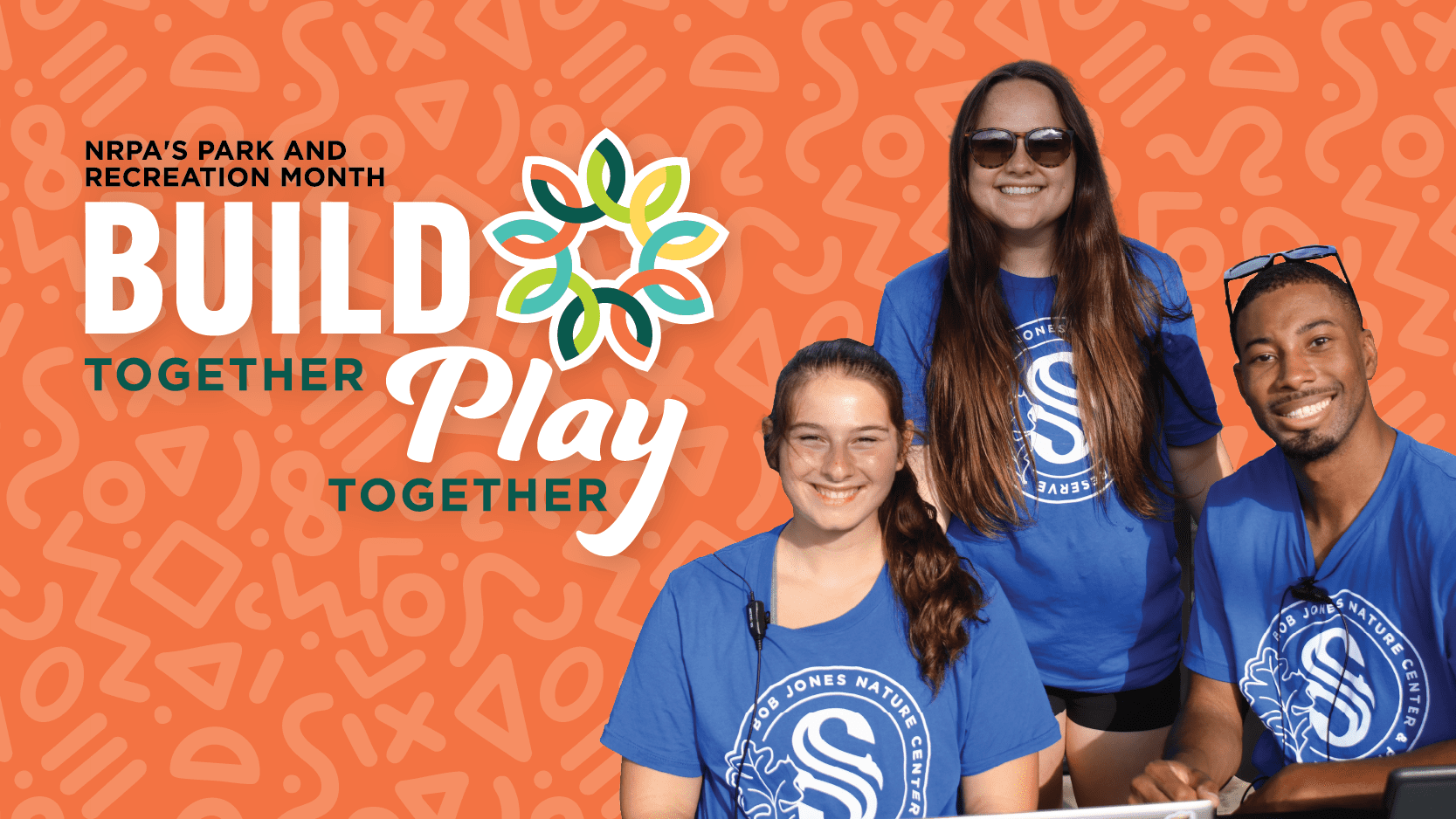 Three smiling young adults wearing matching blue shirts sit and stand together in front of an orange background with text: "NRPA's Park and Recreation Month. Build Together, Play Together.