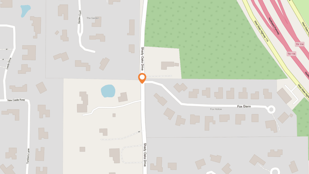 A map showing Shady Oaks Drive intersecting with Fox Glen and Fox Hollow, near a wooded area and a pond. A location marker is placed near the intersection on Shady Oaks Drive.