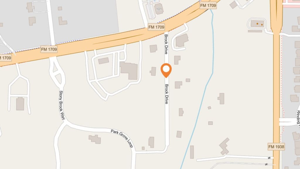A digital map showing Brook Drive intersecting with FM 1709. An orange location marker pinpoints a spot on Brook Drive. Nearby roads include Sunny Brook Vista and Park Grove Lane. Buildings and property outlines are visible.