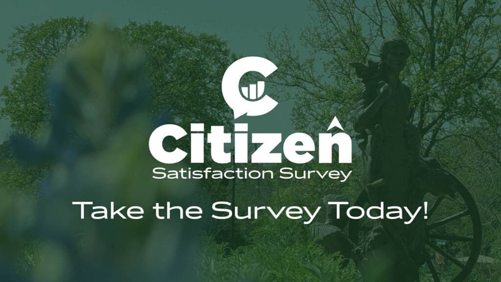 Graphic with the text "Citizen Satisfaction Survey" and "Take the Survey Today!" overlaid on a blurred outdoor background featuring trees and a statue.