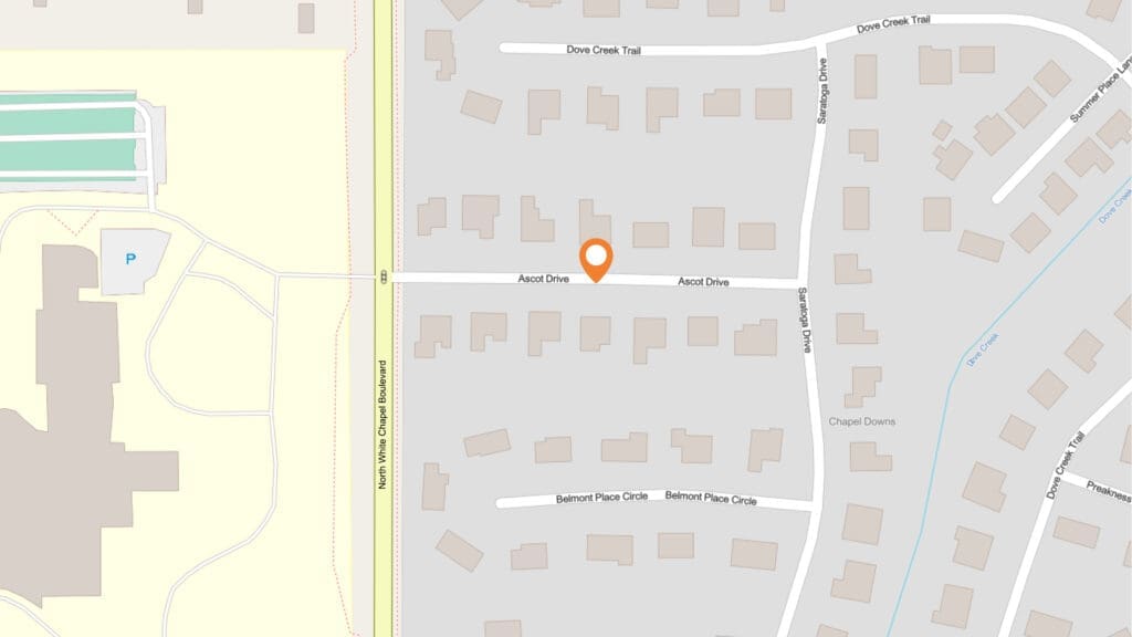 A digital map highlighting a location on Azcot Drive, near North Vista Grande Boulevard. Surrounding streets include Dove Creek Trail, Serendipity Drive, Chapel Downs, and Belmont Place Circle.