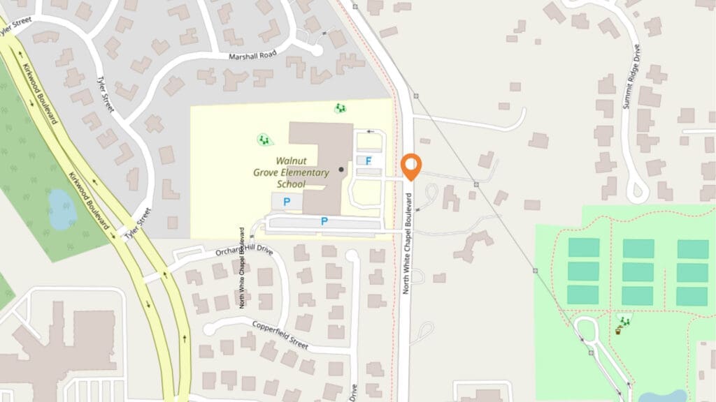 Map showing Walnut Grove Elementary School, nearby streets including North White Chapel Boulevard, and surrounding residential areas. A marker pin is placed near the school's entrance. Several parking lots and tennis courts are visible.