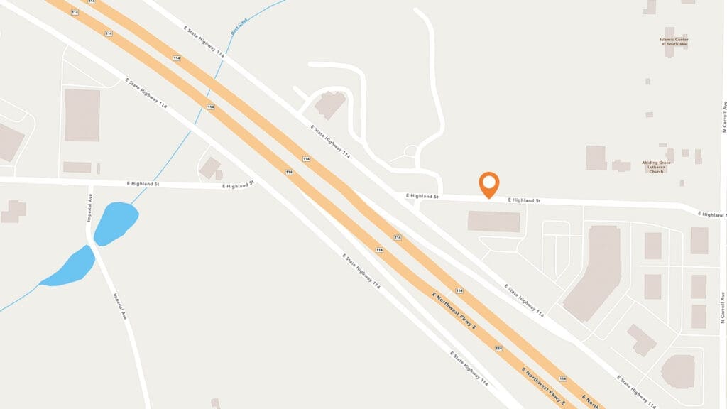 A map displays highways, streets, buildings, and a pond. An orange location pin marks a spot on E England St, near intersecting roads and a cluster of buildings.