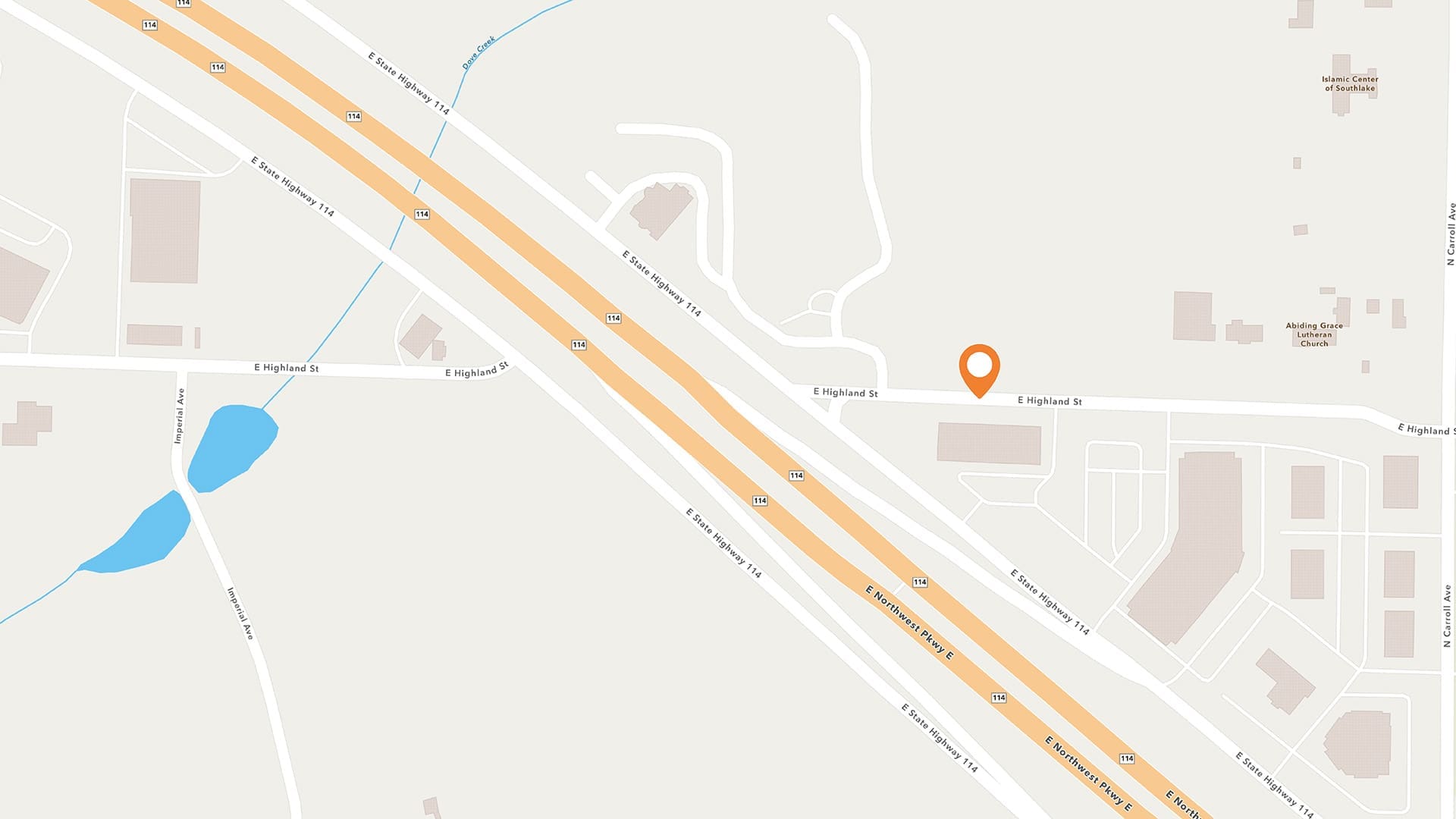 A map displays highways, streets, buildings, and a pond. An orange location pin marks a spot on E England St, near intersecting roads and a cluster of buildings.