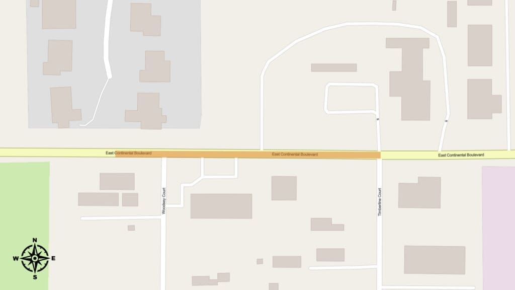 A map showing East Continental Boulevard running horizontally. Buildings are displayed in light brown, and a compass rose is in the lower left corner.