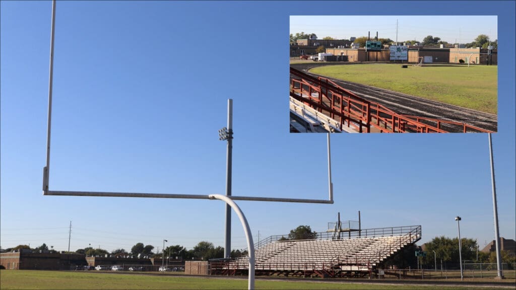 A football field with a white goalpost in the foreground under a clear blue sky; an inset shows empty metal bleachers and a running track with buildings in the background.
