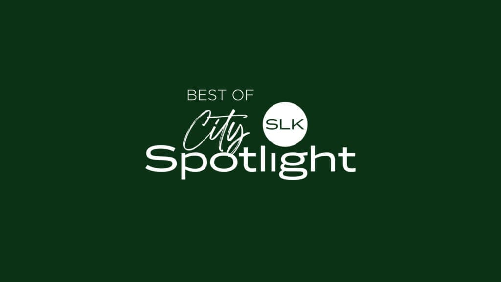 White text on a dark green background reads "Best of City Spotlight," with "SLK" in a white circle between "City" and "Spotlight.