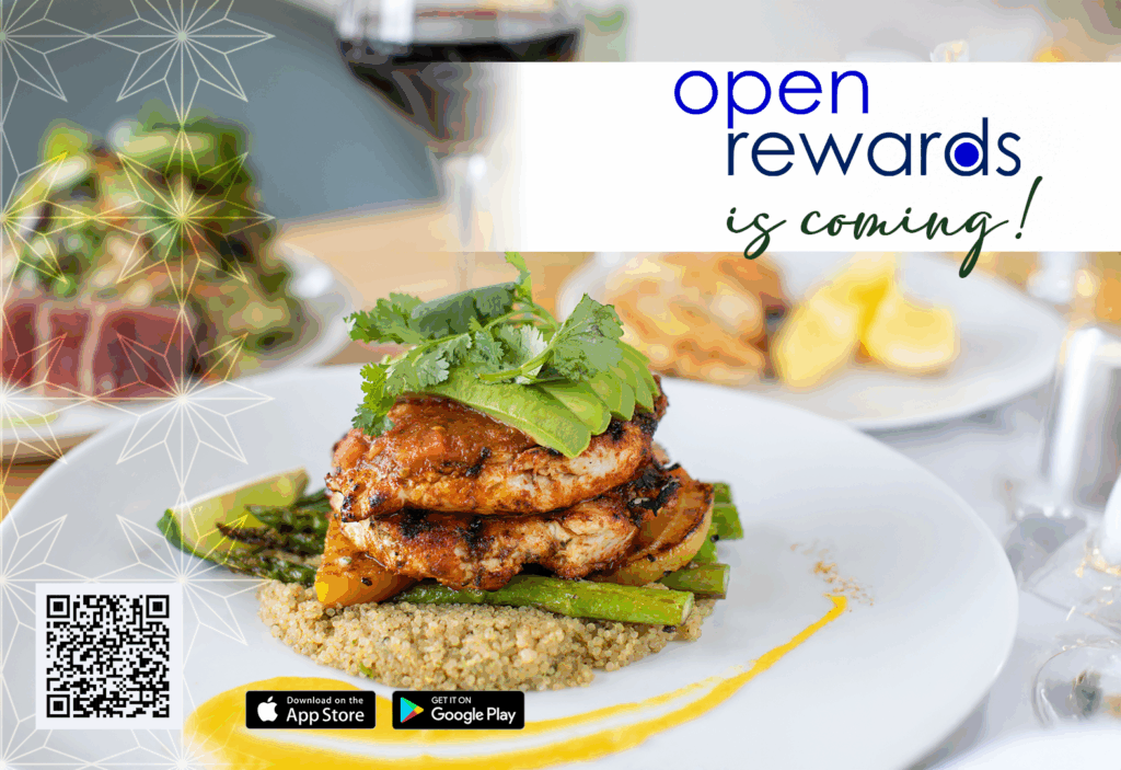 A close-up of a plated grilled chicken dish with asparagus and grains garnished with herbs. In the background, wine and salad are visible. Text reads "open rewards is coming!" with app store icons and a QR code.