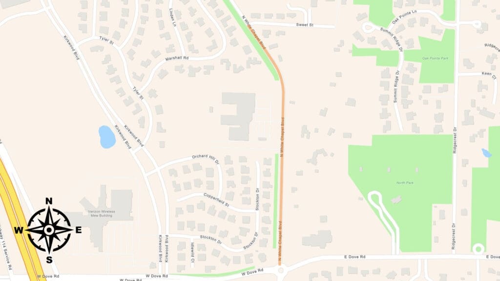 A map showing a suburban neighborhood with curved streets, houses, parks, and a highlighted road running north-south. There is a compass rose in the lower left and North Park in the bottom right section.
