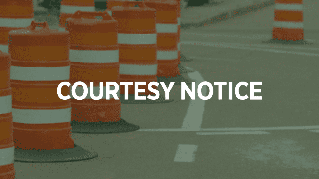 Orange and white traffic barrels line a street, with the words "COURTESY NOTICE" in bold white text centered over the image.