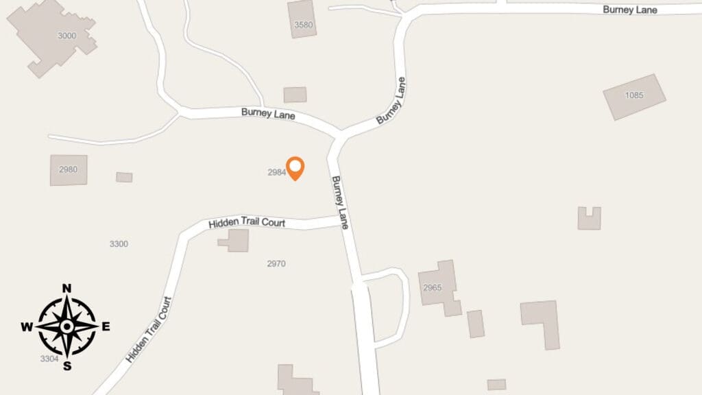 A map shows Burney Lane, Hidden Trail Court, and surrounding roads with several labeled buildings. An orange location pin marks the address 2984 Burney Lane. A compass rose is in the lower left corner.
