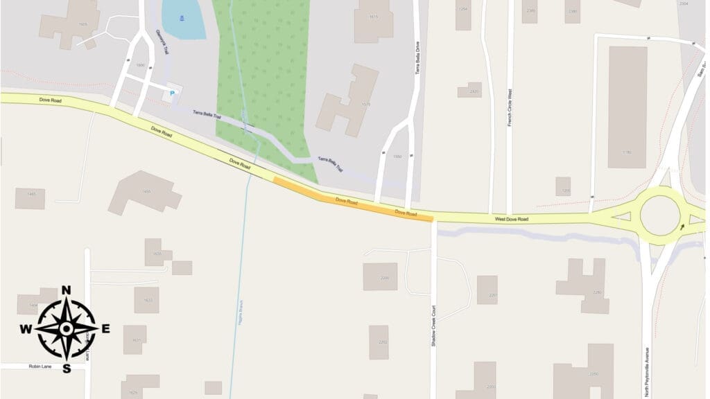 A map showing a section of West Shoals Road and Duro Street, including a roundabout, surrounding buildings, and a green park area. A compass rose is in the bottom left corner, indicating north.