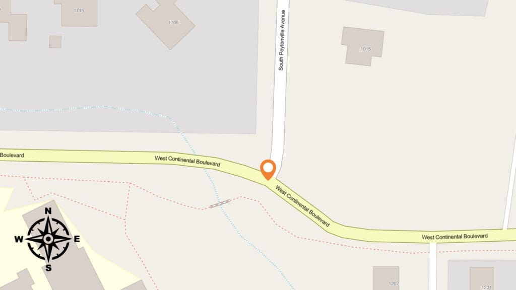 A map showing the intersection of South Fryorthville Avenue and West Continental Boulevard, with a location pin marking the spot. A compass rose with directions is in the lower left corner. Buildings are shown nearby.